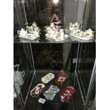 11 assorted Limoges minature tea sets (2 shelves).