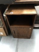 An oak bedside cabinet