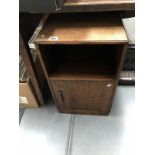 An oak bedside cabinet