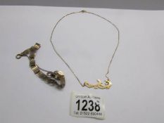 A 9ct gold hall marked gate bracelet (8g) and an Arabic pendant on 18ct gold chain marked 750