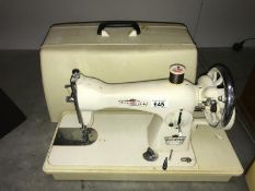 A cased Princess sewing machine