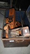 A tin box of old tools.