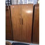 A teak double door wardrobe