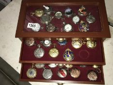 A 3 drawer watch cabinet containing 38 reproduction pocket watches.
