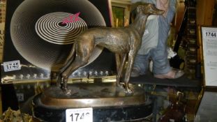 A bronze greyhound.
