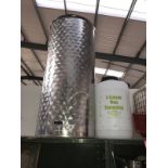 A 150 Litre stainless steel tapped storage tank and a 5 gallon plastic wine fermenter