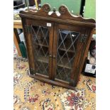 A lead glazed corner cupboard