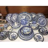 A Wedgwood meat plate & collection of blue & white Willow pattern dinner ware including gravy boats