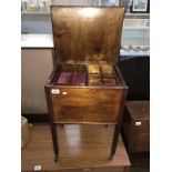 A dark wood stained work table