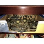 A tray of brass ornaments and pictures plus a large engraved brass vase