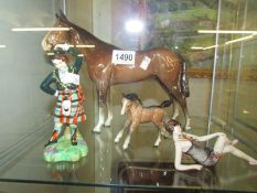 A Beswick horse (ear a/f), a foal and 2 other ornaments.