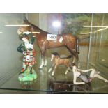 A Beswick horse (ear a/f), a foal and 2 other ornaments.