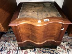 A carved wood box commode