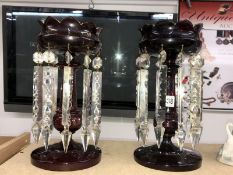 A pair of ruby glass lustres with droppers (decoration worn).