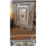 A small wooden cabinet and a stool.