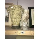 An oriental vase with elephant head and a concrete owl garden ornament