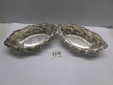 A pair of ornate silver bon bon dishes, London 1902/03, 6.75 ounces.