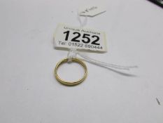 A 22ct gold wedding ring, size M half.