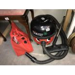 A Henry hoover with accessories bag