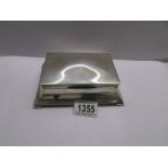 An art deco silver trinket box, hall marked but indistinct, gross weight 480 grams.