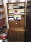 A drinks cabinet / book case wall unit