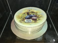 A large fruit decorated plate and 12 smaller examples.