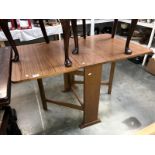 A drop leaf kitchen table
