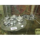 A 22 piece miniature pewter coffee set comprising tray, coffee pot, 2 sugar bowls, milk jug, 6 cups,