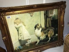 A gilt framed print of a girl with dog