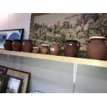 8 earthenware jugs including Price, Devon Pitcher etc.