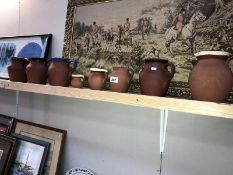 8 earthenware jugs including Price, Devon Pitcher etc.