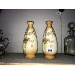 A pair of ornate Devonware vases A/F