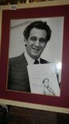 A signed photograph with notes and opening music by Spanish opera singer and conductor Placido