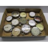 A tray of old pocket watches for spare or repair.