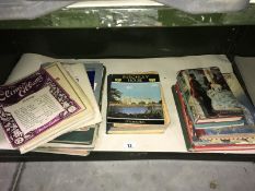 A mixed lot of ephemera including scrap books, children's books, song/music sheets etc.