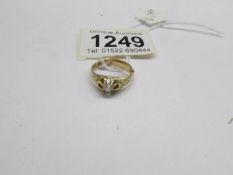 An 18ct gold and diamond ring, size M.