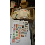 A quantity of stamp albums with stamps and a box of first day covers and other stamps.