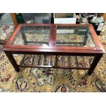 A wooden coffee table with glass inserts