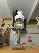 A Victorian column oil lamp with later shade and chimney.