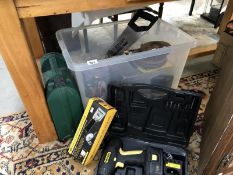 A box of Sundry tools including 2 cased electric drills, hand tools, 2 old tape measures,