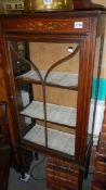 An Edwardian inlaid display cabinet.