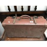 A vintage 'Revelation' suitcase.