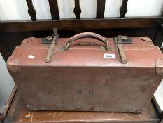 A vintage 'Revelation' suitcase.