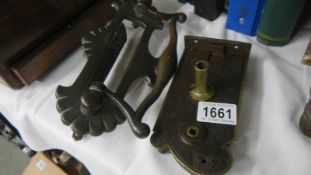 A Victorian brass letter box/door knocker and an ormolu brass lock.