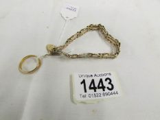 A 9ct gold bracelet (hall mark to padlock 1984) approximately 12 grams and a 22ct gold wedding band