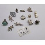 Approximately 14 charms and fobs including some silver.