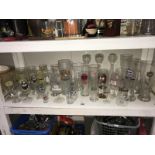 A large number of drinking glasses,