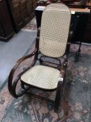 A rocking chair with bergere seat and back