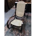 A rocking chair with bergere seat and back