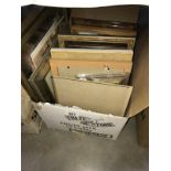 A box of pictures and picture frames